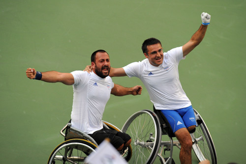 Michael Jeremiasz and Stephane Houdet of France celebrate. They beat Stefan Olsson and Peter Wikstrom of Switzerland 2-0 to win the gold medal of the Men's Doubles Open of the Wheelchair Tennis event during the Beijing 2008 Paralympic Games on September 15, 2008.