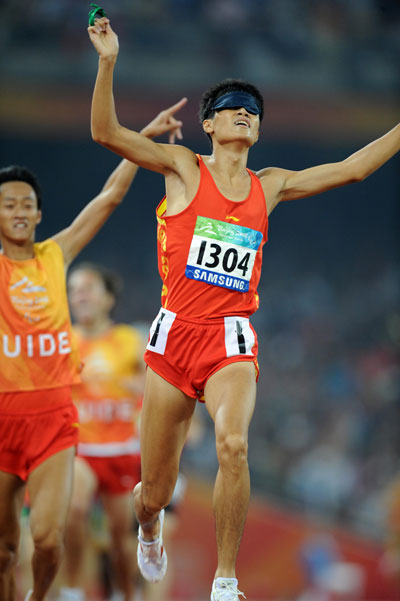 China's Zhang Zhen won the gold of the Men's 1500m - T11 with a time of 4 minutes and 10.05 seconds at the National Stadium,also known as the Bird's Nest,during the Beijing 2008 Paralympic Games on September 15, 2008. 