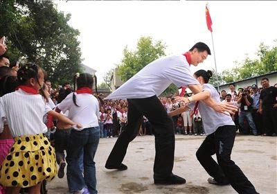 Yao Ming participates in a short ceremony at the Jianshecun Village Elementary School, the first school built from Yao Ming's donations to the earthquake-hit region.