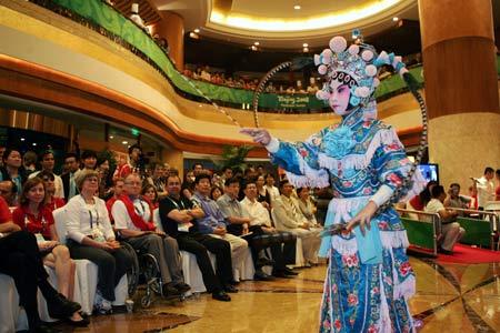 An actor performs Peking Opera during the Mid-Autumn soiree in Beijing, capital of China, September 14, 2008. Some officials and athletes of Beijing Paralympic Games and some foreign guests attended a soiree on Sunday night to celebrate the Mid-Autumn Festival, a traditional Chinese festival for family reunions, by enjoying traditional Chinese culture. (Xinhua Photo)