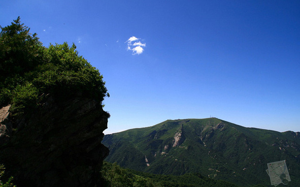 High-up clouds drift over the grassland on Qinling Mountains which are mainly located in Shannxi Province.