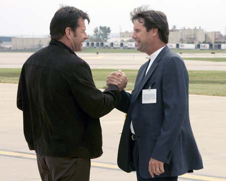 European Ryder Cup Captain Nick Faldo (L) of Britain is greeted by U.S. Ryder Cup Captain Paul Azinger after the European team arrived at Louisville International Airport In Louisville, Kentucky September 15, 2008 for the 37th Ryder Cup Championship to be played at the Valhalla Golf Club in Louisville. 
