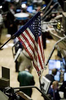 Traders work on the floor of the New York Stock Exchange in New York. Shares in American International Group plummeted more than 50 percent Monday on fears the US insurance giant could be the next domino to fall in the worst banking crisis to shake Wall Street since the Great Depression.(AFP)