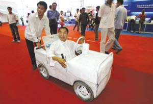 The undated photo shows Guo Wen drives his homemade car at an exhibition.[photo:sohu.com]