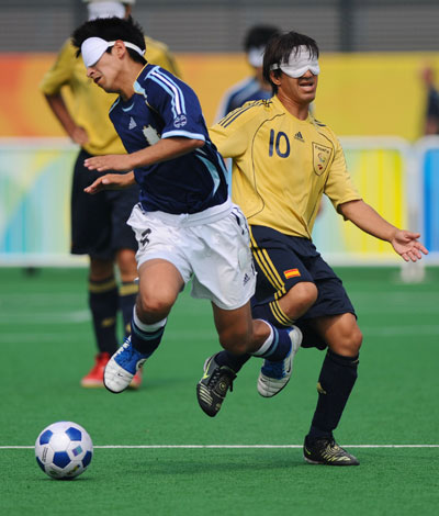 Argentine Lucas Rodriguez (L) vies with Vicente Aguilar of Spain. Argentina beat Spain 2-1 in the Football 5-a-Side bronze medal match during the Beijing 2008 Paralympic Games on September 17, 2008. 