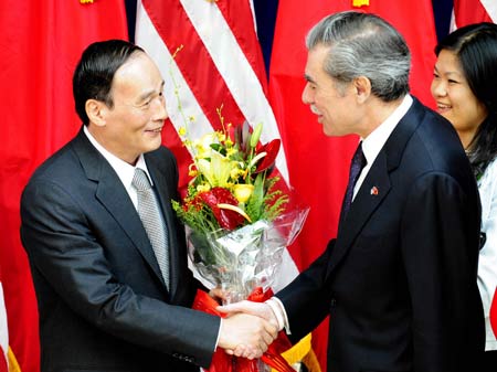 Chinese Vice Premier Wang Qishan (L) and US Secretary of Commerce Carlos Gutierrez greet each other before the 19th session of the China-U.S. Joint Commission on Commerce and Trade (JCCT), at the Richard Nixon Presidential Library in a Los Angeles suburb, on Sep. 16, 2008. 
