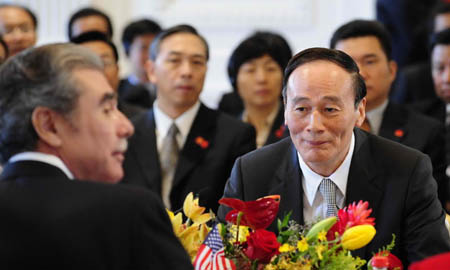 Chinese Vice Premier Wang Qishan (R) meets with US Secretary of Commerce Carlos Gutierrez during the 19th session of the China-U.S. Joint Commission on Commerce and Trade (JCCT), at the Richard Nixon Presidential Library in a Los Angeles suburb, on Sep. 16, 2008.