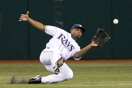 Tampa Bay Rays outfielder Fernando Perez makes a sliding catch against the Boston Red Sox during the second inning of their American League MLB baseball game in St. Petersburg, Florida September 17, 2008.