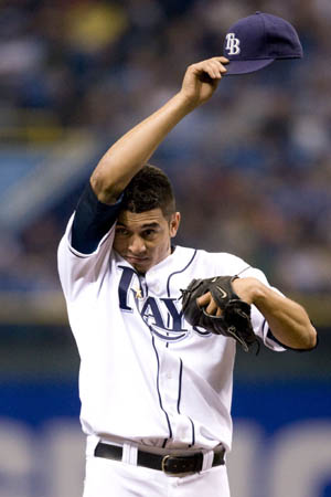 Tampa Bay Rays pitcher Matt Garza wipe his head after giving up a home run to the Boston Red Sox David Ortiz during the first inning of their American League MLB baseball game in St. Petersburg, Florida September 17, 2008.