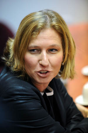 The file photo taken on September 15, 2008 shows Israeli Foreign Minister Tzipi Livni smiling during a meeting with her Spanish counterpart Miguel Angel Moratinos in Tel Aviv, Israel. Final results released by Israel's ruling Kadima party early Thursay showed that Foreign Minister Tzipi Livni won the party's primary, local news service Ynet reported. (Xinhua/Yin Bogu)