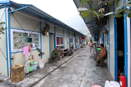 Residents are seen besides their makeshift homes in Southwest China's Sichuan Province on September 18, 2008. 