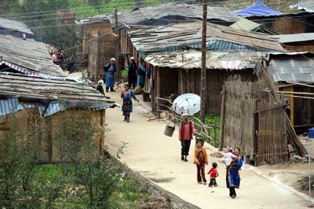 Villagers are seen outside their makeshift homes in Southwest China's Sichuan Province on September 18, 2008. 