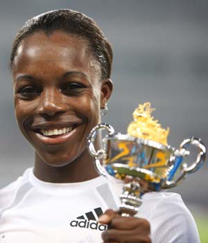 Veronica Campbell-Brown of Jamaica shows her trophy during the awarding ceremony for the women's 100m of the 2008 Shanghai Golden Grand Prix track and field event in Shanghai, China, Sept. 20, 2008. Veronica Campbell-Brown won the title with 11.01 seconds. 
