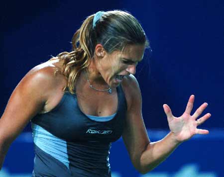 France's Amelie Mauresmo reacts while competing against Slovakia's Dominika Cibulkova during women's singles first round match at the 2008 China Open in Beijing, capital of China Sept. 22, 2008. Mauresmo lose to Cibulkova 1-2. 