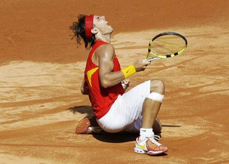 Spain's Rafael Nadal celebrates his victory over Andy Roddick of the U.S. at the end of their singles tennis match for their Davis Cup semi-final match at Madrid's Las Ventas bullring September 21, 2008.