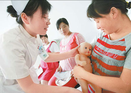 Mothers-to-be learn how to breast-feed at a hospital in Weifang, Shandong province. More and more women are opting to 'go natural' in the wake of the poisoned baby milk scandal.