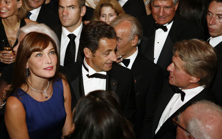 France's President Nicolas Sarkozy and his wife Carla Bruni-Sarkozy talk with actor Michael Douglas before receiving the Humanitarian Award at the Elie Wiesel Foundation For Humanity awards dinner in New York September 22, 2008. Sarkozy is scheduled to address the United Nations General Assembly on Tuesday.