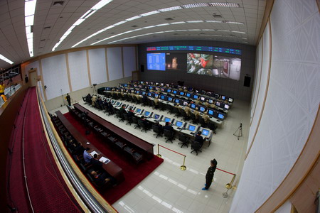 Engineers monitor the operations of the Shenzhou-7 spacecraft mission during a joint drilling of all systems in Dongfeng Command and Control Center, Jiuquan Satellite Launch Center in Northwest China's Gansu Province September 22, 2008.