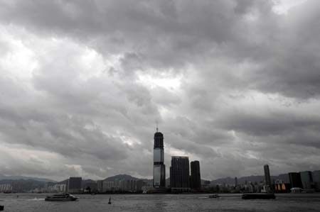 Heavy clouds hang over the city of Hong Kong, south China, Sept. 23, 2008. Hagupit, the 14th typhoon to affect China this year, is poised for landfall in the southern Guangdong Province on Wednesday, meteorological stations in Fujian and Guangdong provinces warned on Monday. (Xinhua/Lo Pin Fai)