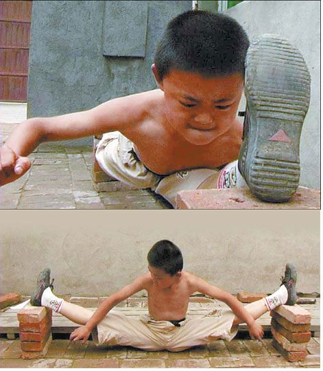Nine-year-old Yuan Peng practices splits.