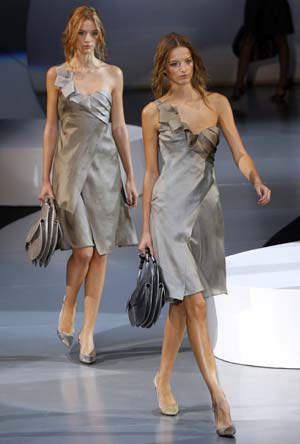 Models display creations as part of the Giorgio Armani Spring/Summer 2009 women's collection during Milan Fashion Week September 22, 2008.