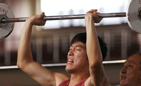 Chinese hurdler Liu Xiang takes part in a training session in Shanghai, Sept. 23, 2008. This is Liu's first public training after he pulled out of the men's 110 meters hurdles because of injuries in Beijing Olympic Games on Aug. 18, 2008.