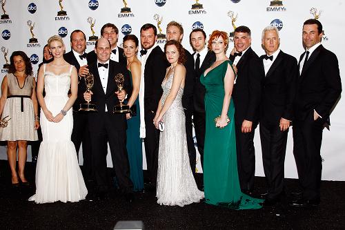 Producer/writer Matthew Weiner (5th from L) poses in the press room with the Emmy for Best Drama Series for &apos;Mad Men&apos; during the 60th Primetime Emmy Awards held at Nokia Theatre on September 21, 2008 in Los Angeles, California. [Xinhua]