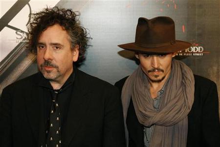 Tim Burton (L) and Johnny Depp pose for photographers at the premiere of the film 'Sweeney Todd: The Demon Barber Of Fleet Street' in Paris January 16, 2008.