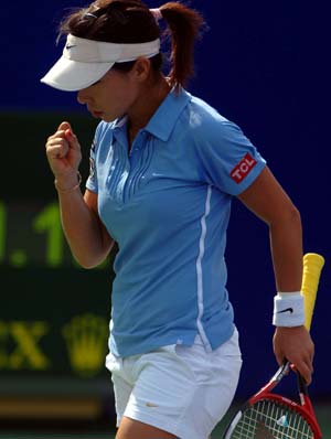 China's Zheng Jie celebrates scoring during the women's singles quarterfinal against Serbia's Ana Ivanovic at the 2008 China Open in Beijing, capital of China, Sept. 26, 2008. Zheng won 2-1 and qualified for the semifinal.