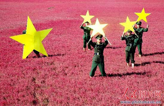 Border guards in China's northeastern Liaoning province created this giant national flag by holding up hand-made stars in a field full of red plants. The soldiers said they were celebrating China's October 1 National Day, and also hoping to attract tourists to the region.