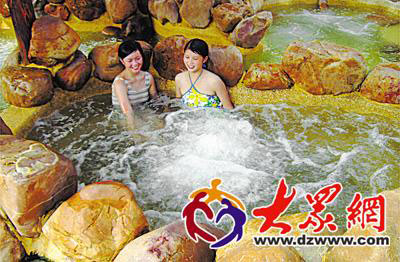 Two girls enjoy the hot spring in Wendeng, Shandong Province, in this undated photo.