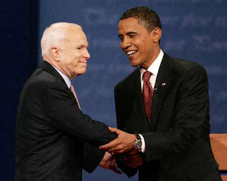 U.S. Republican presidential candidate John McCain (L) and U.S. Democratic presidential candidate Barack Obama meet as they walked onstage during the first U.S. presidential debate at the University of Mississippi in Oxford, Mississippi, September 26, 2008. 