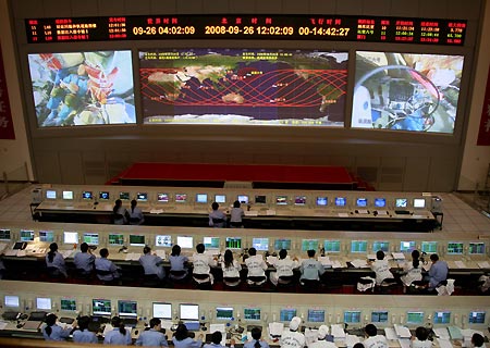 The ground crew work at the Beijing Space Command and Control Center in Beijing, capital of China, Sept. 26, 2008. The Shenzhou-7 spacecraft, which blasted off at 9:10 p.m. Thursday at the Jiuquan Satellite Launch Center in northwest China's Gansu Province, has functioned well as planned.