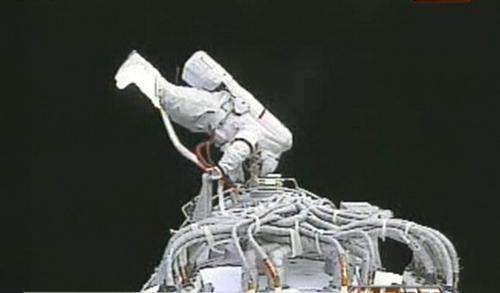Chinese taikonaut Zhai Zhigang slipped out of the orbital module of Shenzhou-7 Saturday afternoon, starting China's first spacewalk or extravehicular activity (EVA) in the outer space.