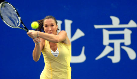 Serbian Jelena Jankovic returns a ball during the women's singles semifinal against Russia's Vera Zvonareva at the 2008 China Open in Beijing, capital of China, Sept. 27, 2008. Jankovic won 6-4, 2-6, 6-4. [Xinhua]