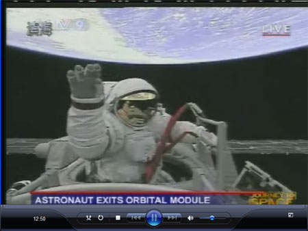 The video grab taken on Sept. 27, 2008 in Beijing, China, shows Chinese taikonaut Zhai Zhigang waves after opening the door of the orbital module. [Xinhua]