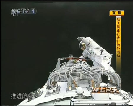 The video grab taken on Sept. 27, 2008 in Beijing, China, shows Chinese taikonaut Zhai Zhigang collectting the test sample of solid lubricant placed outside the orbital module. 