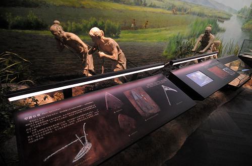 The scene from ancient residents' daily life is displayed in the Liangzhu Culture Museum in Hangzhou, Zhejiang province, in this photo taken on Thursday, September 25, 2008.