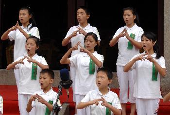 Disabled children recites  Analects of Confucius during the ceremony held in Quzhou, Zhejiang Province Sep. 28 to commemorate 2559th birthday of Confucius.