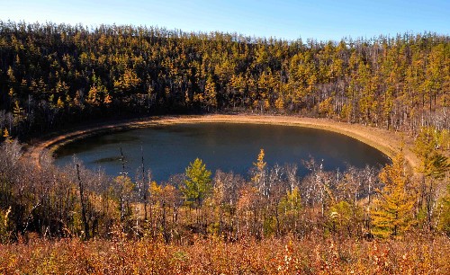 This photo taken on September 27, 2008 shows the beautiful natural landscape of a crater lake in Chaihe Natural Scenic Spot in Zhalantun City, in northern China's Inner Mongolia Autonomous Region, in the southeastern foothills of the Greater Khingan Mountains. The scenic spot is expected to see a rise in tourism during the ongoing National Day holiday. [Xinhua]