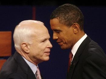 Republican presidential nominee Senator John McCain (L) and Democratic presidential nominee Senator Barack Obama stand together onstage after the first U.S. presidential debate in Oxford, Mississippi, September 26, 2008.(Xinhua/Reuters Photo)