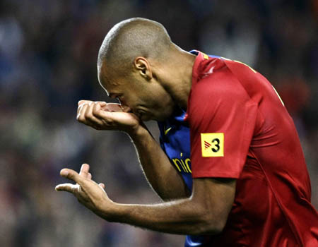 Barcelona's Thierry Henry celebrates his goal against Atletico Madrid during their Spanish first division soccer match at Nou Camp stadium in Barcelona, October 4, 2008.