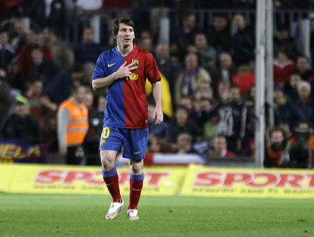 Barcelona's Lionel Messi gestures to coach Josp Guardiola as he celebrates his goal against Atletico Madrid during their Spanish first division soccer match at Nou Camp stadium in Barcelona October 4, 2008.