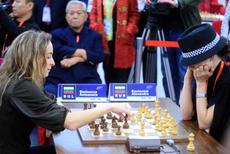 Antoaneta Stefanova (L) of Bulgaria competes during the women's chess individual blitz against Alexandra Kosteniuk of Russia in the 1st World Mind Sports Games in Beijing, capital of China, Oct. 5, 2008.