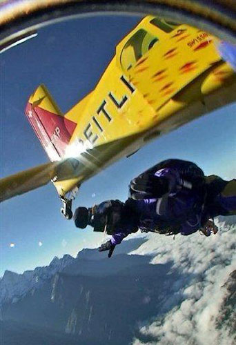 A Mount Qomolangma skydive team member leaps from an aircraft. [AFP]