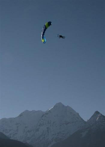 A Mount Qomolangma skydive team member prepares to land. [AFP]