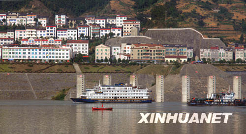 A ferry sails towards the five-tier ship lock of the Three Gorges dam project on October 5th, 2008. 