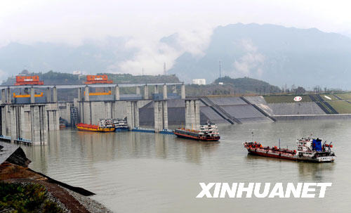 Several vessels sail towards the five-tier ship lock of the Three Gorges dam project on October 4th, 2008. 