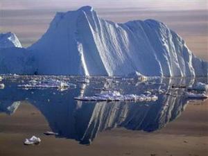 An iceberg carved from a glacier floats in the Jacobshavn fjord in south-west Greenland in this undated handout photograph released on September 20, 2006. [Konrad Steffen/University of Colorado/Handout/Reuters] 