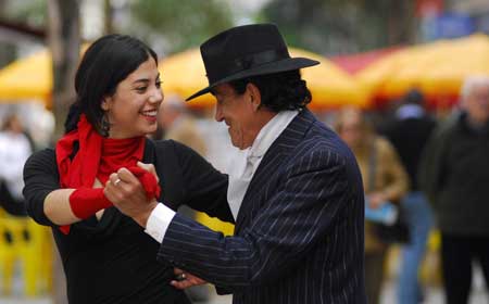 A man and a woman perform tango on a street in Montevideo, Uruguay, Oct. 4, 2008. 
